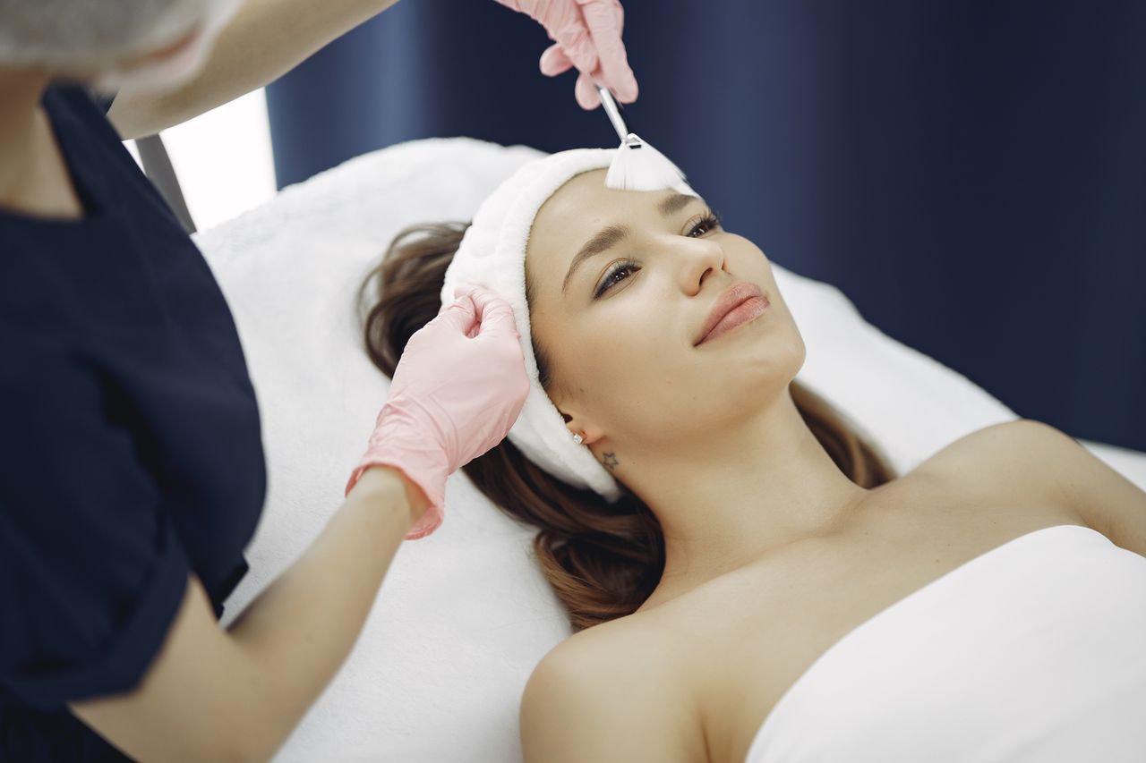 services-05 A woman receives a rejuvenating facial treatment at a spa, promoting relaxation and skincare.